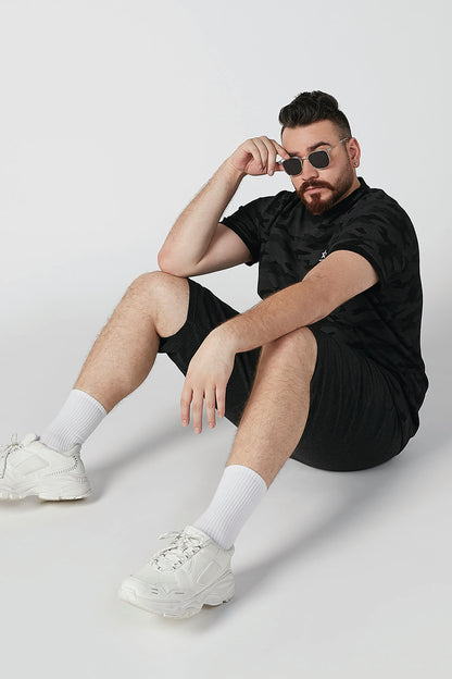 Black heather knit drawstring shorts with cuffed, knee-length hem