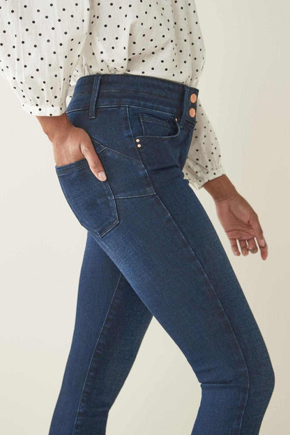 Inky denim jeans back view with patch pockets, belt loops, and button detail