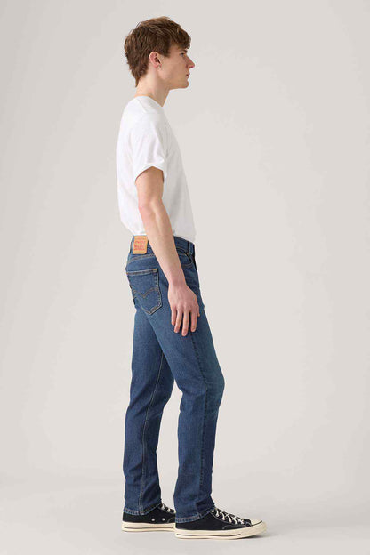 Levi's dark indigo denim jeans, side profile, straight leg, belt loops