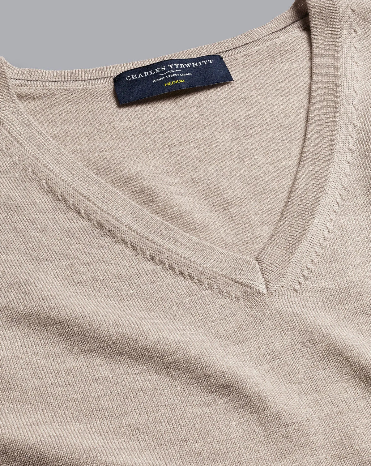 Beige V-neck knit sweater tag detail, Charles Tyrwhitt