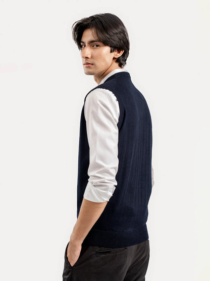 Men's dark blue sleeveless V-neck sweater vest side profile, ribbed knit finish