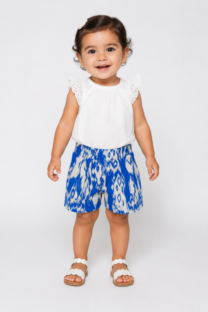 Baby set: white eyelet cap-sleeve top and blue patterned shorts