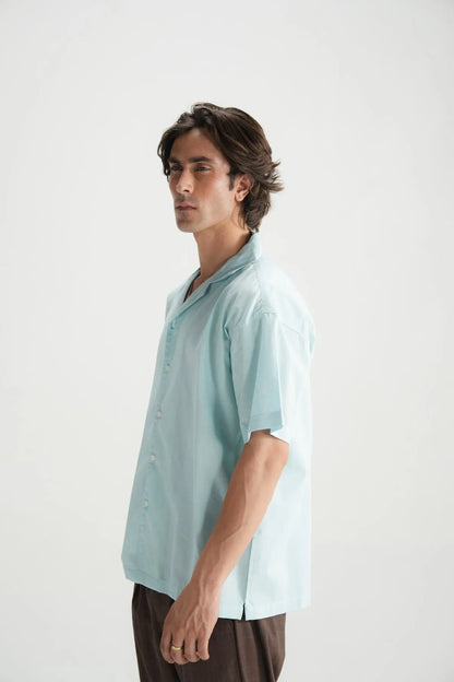 Sky blue short-sleeve button-up shirt, side profile view