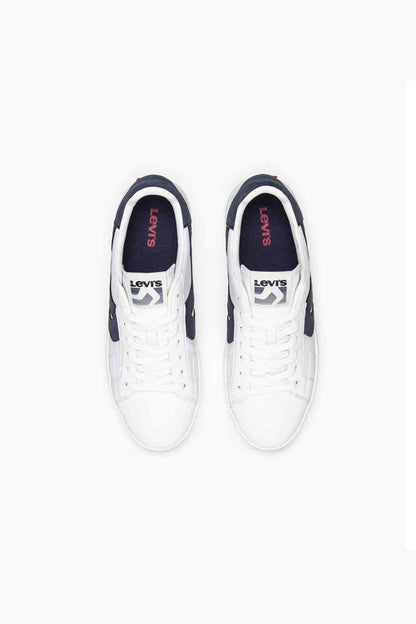 White low-top sneakers, front view, navy heel and side panel accents