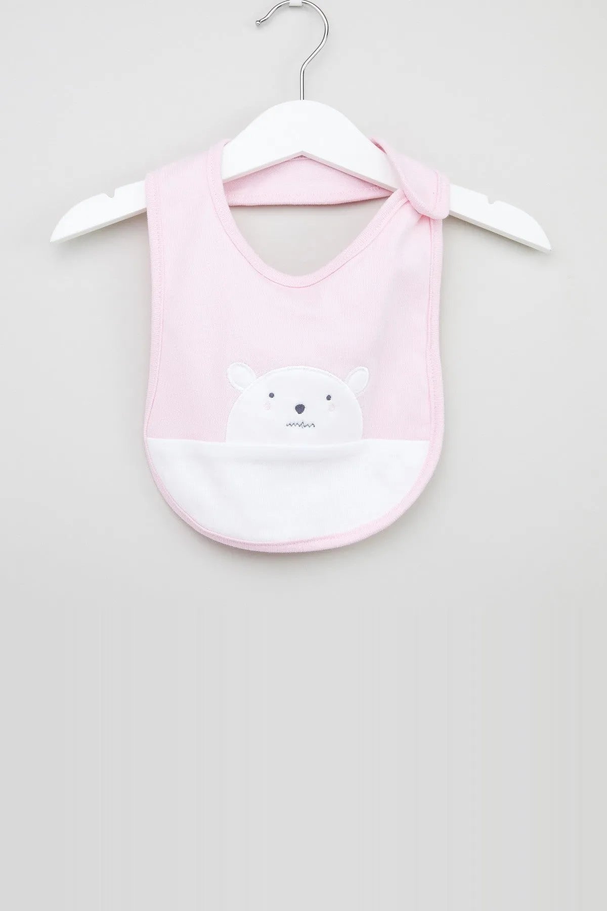 Pink baby bib with bear face applique, snap strap at neck