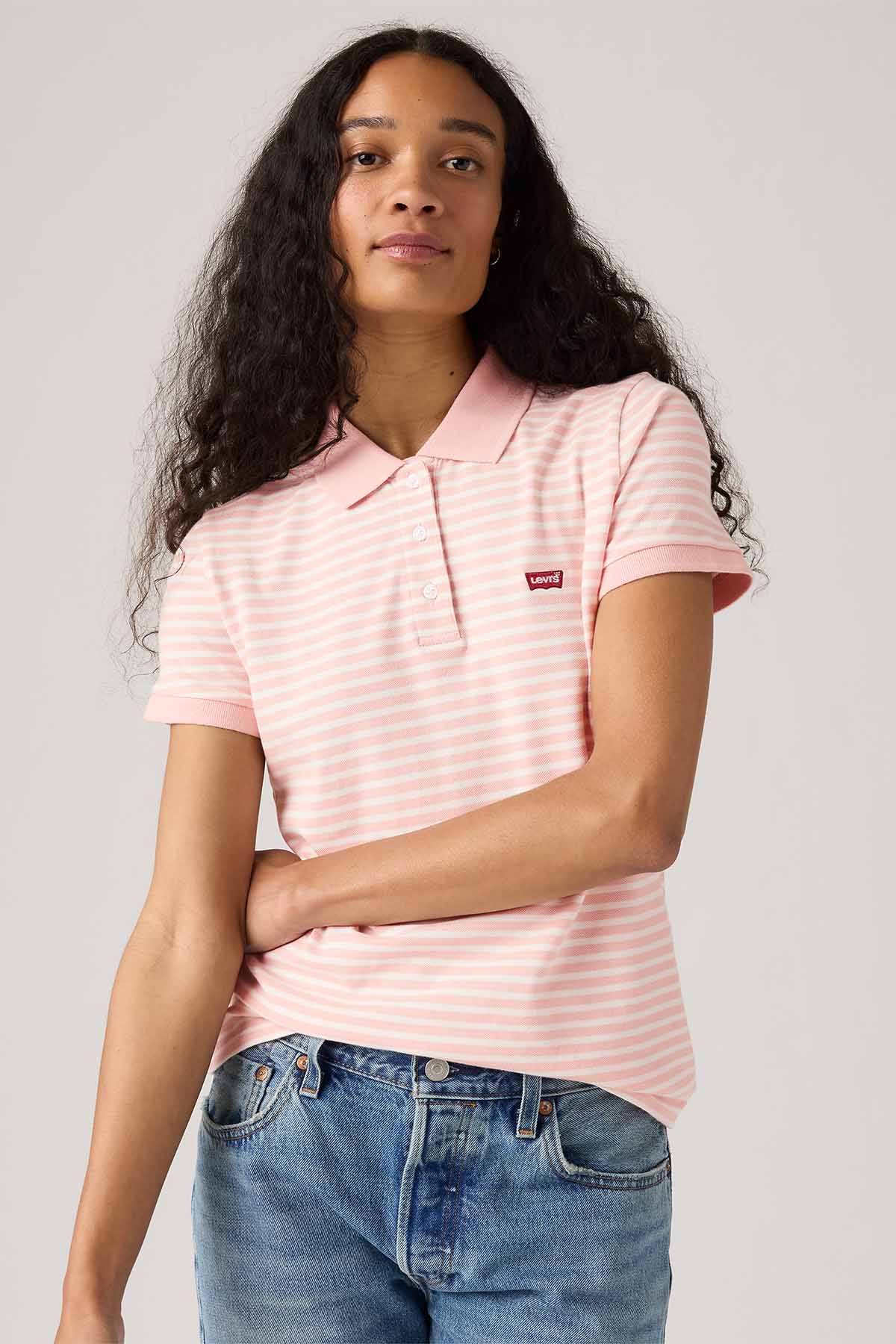 Levi's pink and white striped polo shirt with short sleeves and button placket