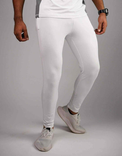 White compression leggings, side view with seam detailing and ankle-length fit