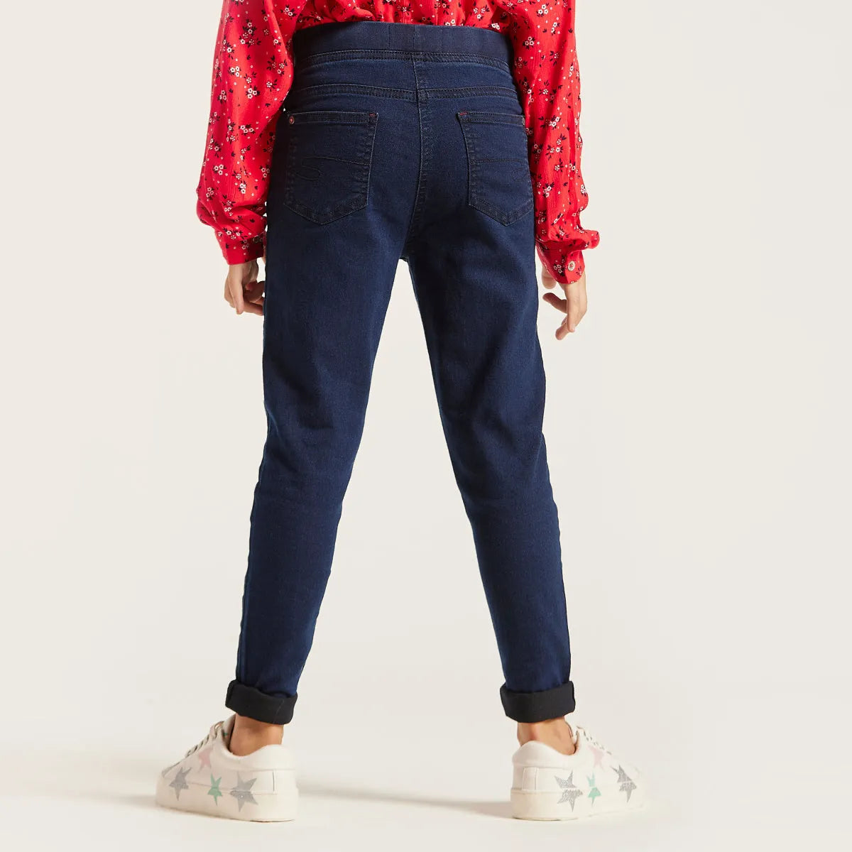 Navy denim jeans with back pockets and tapered fit