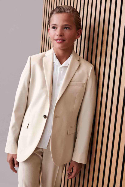 Cream suit set with single-breasted blazer, chest pocket, and matching trousers