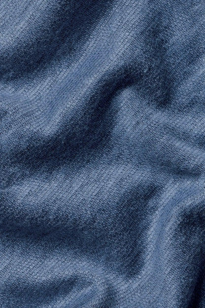 Blue textured polo fabric with fine woven pattern