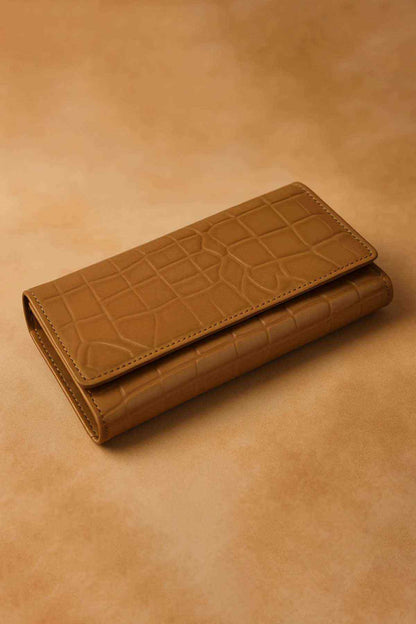 Brown leather wallet with embossed panel and snap-tab closure