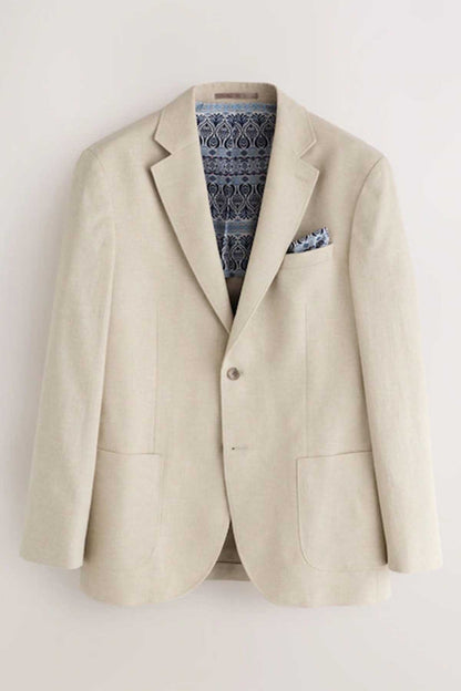 Stone blazer with notch lapels, pocket square, and patterned lining