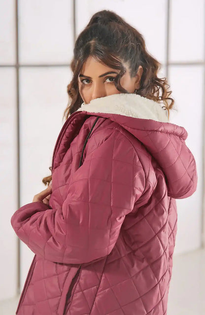 Burgundy quilted hooded jacket with sherpa hood lining and full-length sleeves.