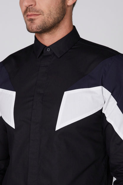 Black men's button-up jacket close-up with white chest panel and button collar