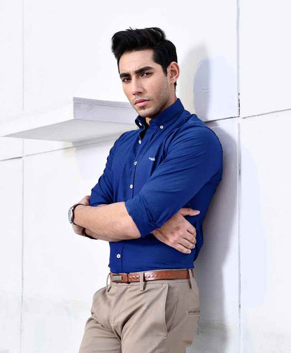 Blue short-sleeve button-up shirt with collar, front buttons, and small chest logo