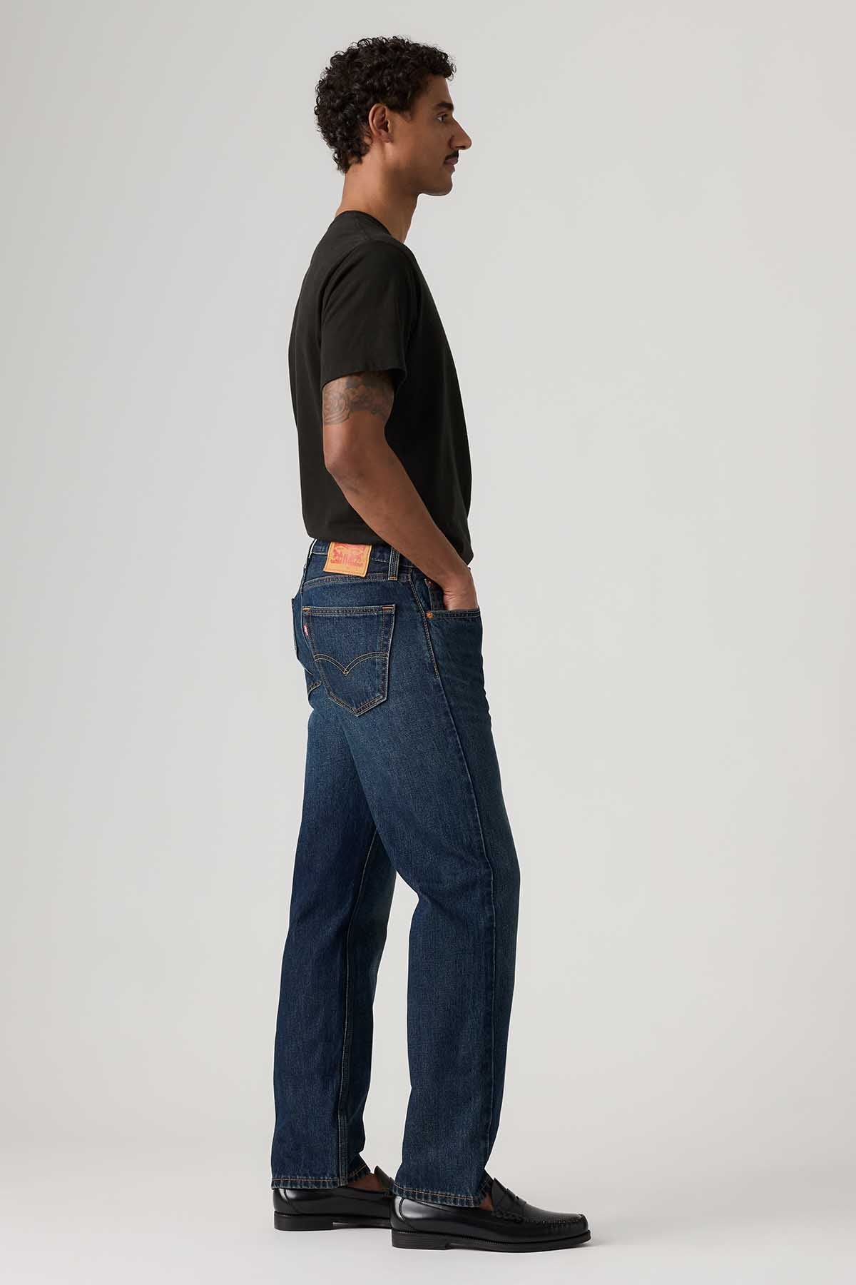 Dark wash jeans side view with straight leg, back patch pocket, belt loops