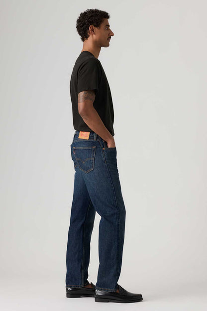 Dark wash jeans side view with straight leg, back patch pocket, belt loops