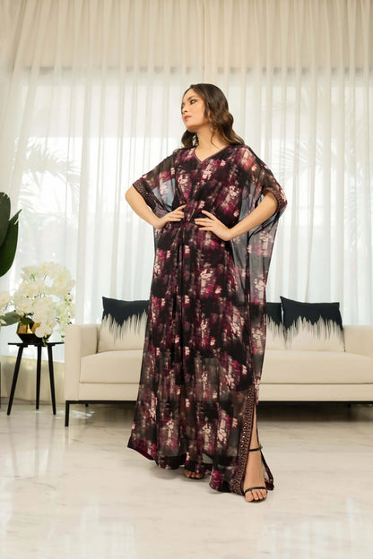 Back view of dark maroon floral maxi dress with round neckline and flowing full skirt