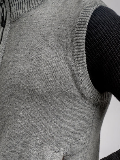 Grey knit vest chest pocket detail and ribbed armhole trim