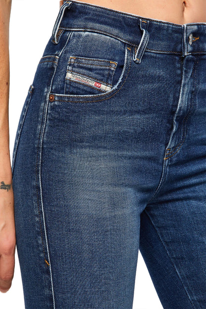 Blue wash denim jeans with angled front pockets and belt loops