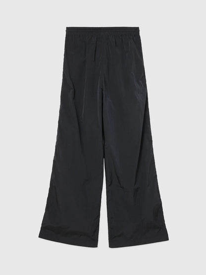 Black wide-leg track pants with elastic waistband and central drawstring