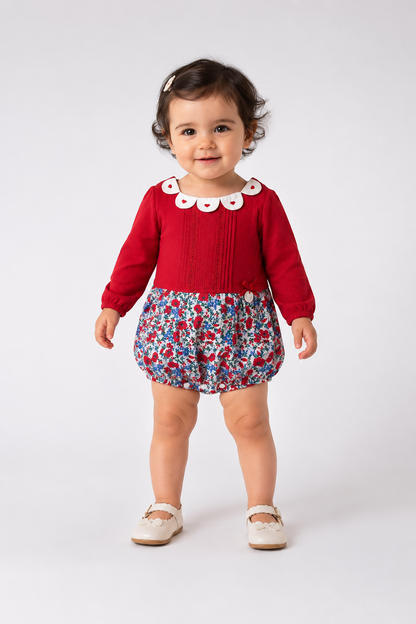 Red long-sleeve baby romper with blue floral shorts and white button collar