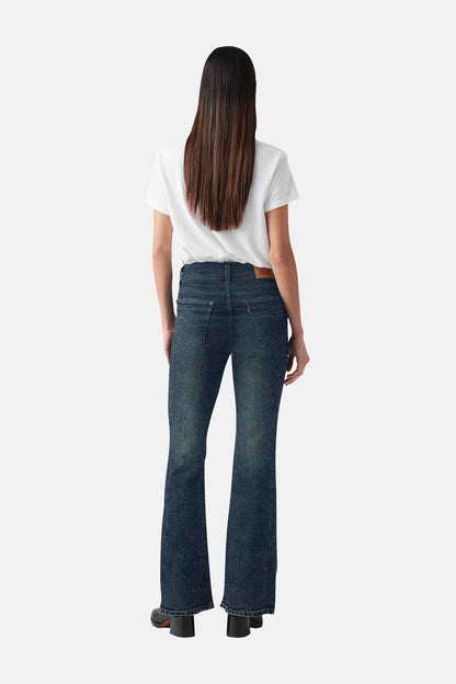 Blue wash flared jeans, back view with dark seam details