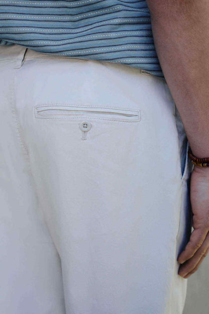 Light beige chino trousers side pocket with button placket detail