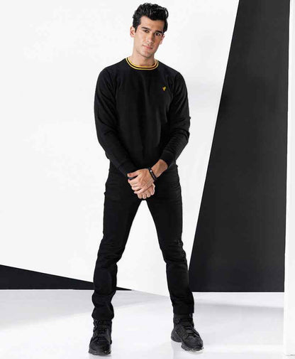 Fitted black crewneck sweatshirt with ribbed yellow trim and small chest logo