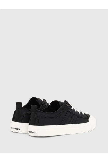 Black Diesel sneakers with heel tab and white outsole, rear three-quarter view