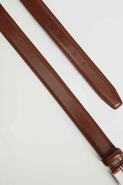Brown leather belt strap with stitched edge and multiple punch holes