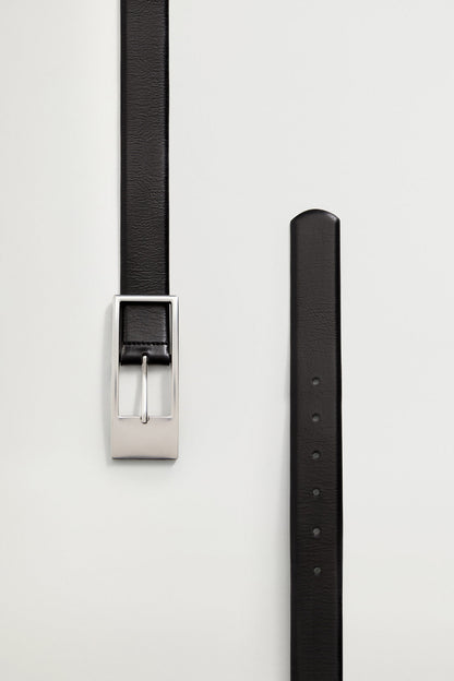 Black belt strap with holes and silver buckle