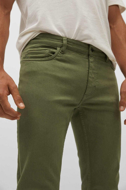 Khaki front pants close-up with seam lines and buttoned waistband