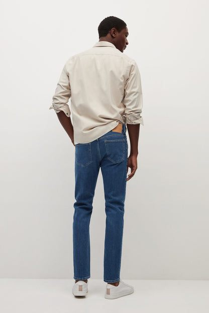 Dark blue denim jeans, straight leg, back view with stitched seams