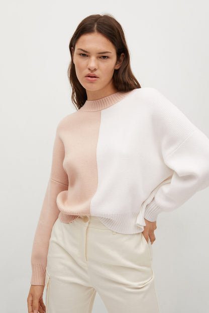 Light pastel grey sleeveless knit sweater with crew neck and ribbed hem
