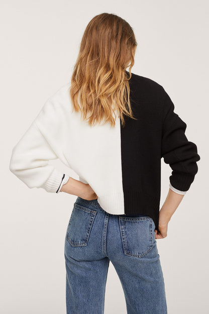 Two-tone knit sweater with black and white back panels, ribbed hem and long sleeves.
