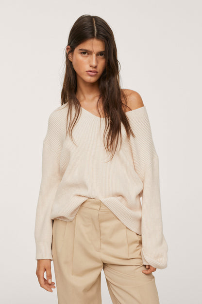 Beige knit off-shoulder sweater front with ribbed cuffs and hem