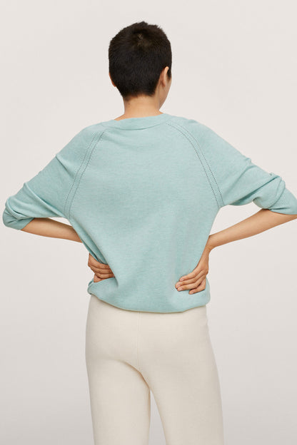 Turquoise long-sleeve sweater from back view, relaxed fit