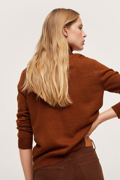 Russet knit turtleneck sweater, side view with long sleeves and curved hem