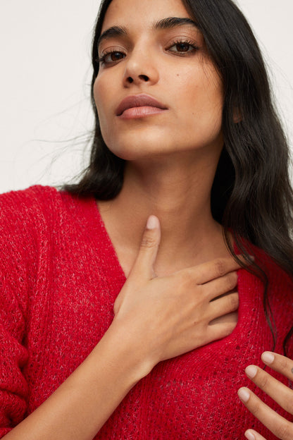 Red textured knit V-neck sweater with long sleeves