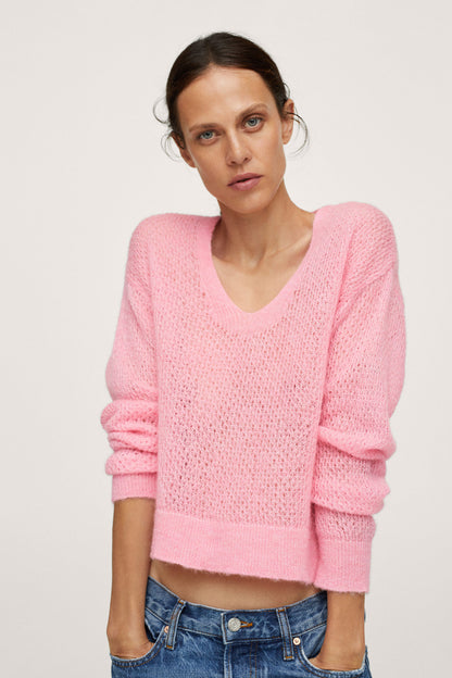 Pastel pink V-neck knit sweater with long sleeves and ribbed hem