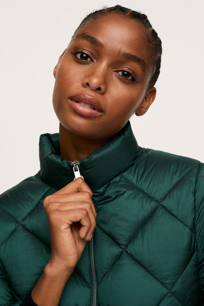 Dark green quilted puffer jacket, high collar and zip detail close-up