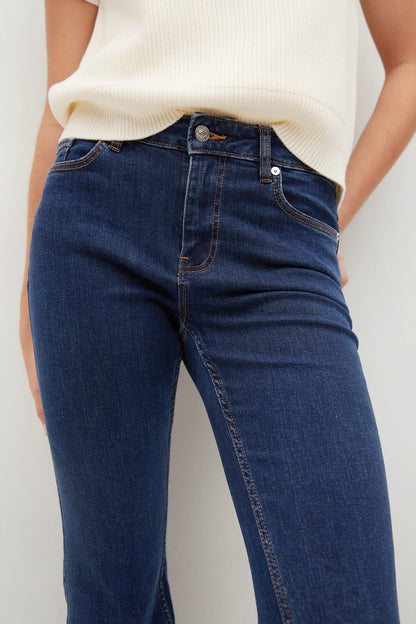 Dark blue denim jeans with button fly and belt loops