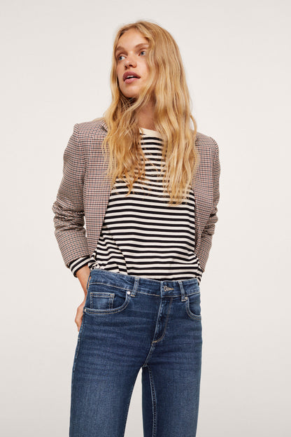 Dark blue skinny jeans with front pockets, button closure, and belt loops
