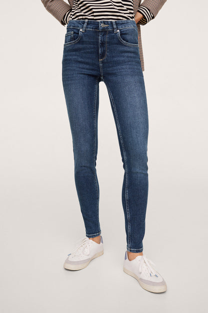 Dark blue skinny jeans with belt loops, zip fly, and five pockets