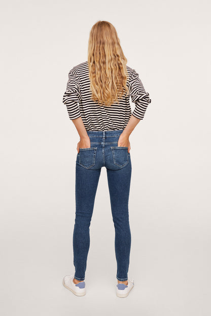 Dark blue skinny jeans, back view with two patch pockets and belt loops