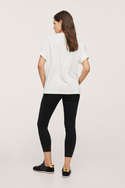 Black denim cropped jeans with button fly and ankle-length hem