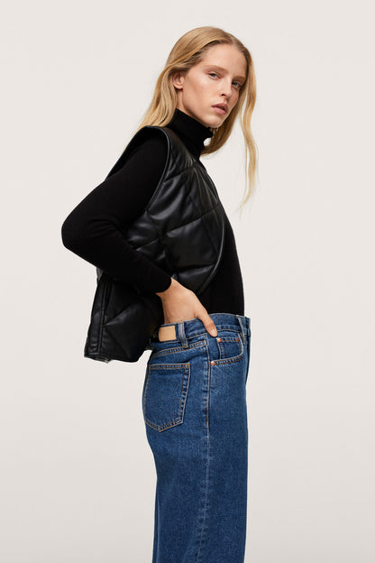 Black quilted zip-front jacket with stand collar and long sleeves