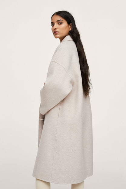 Light pastel gray long overcoat side profile with structured shoulders