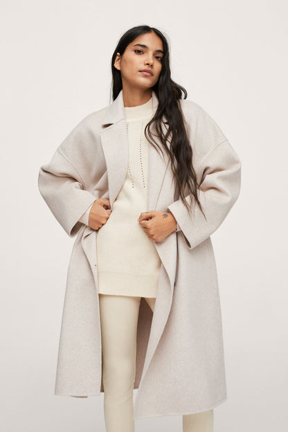 Light pastel gray long overcoat with notched lapels and double-breasted buttons
